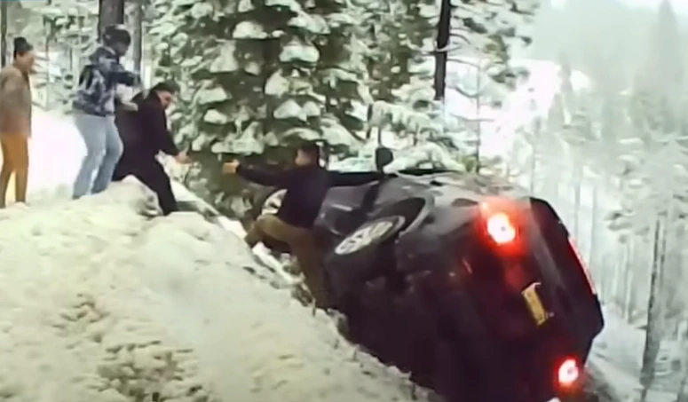 hero rescues passengers car crash snow highway 50