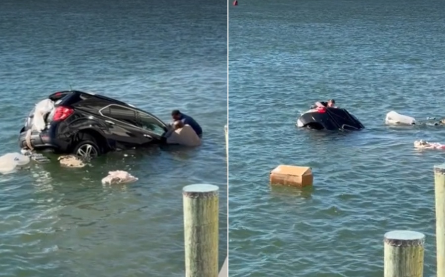men rescue woman sinking SUV