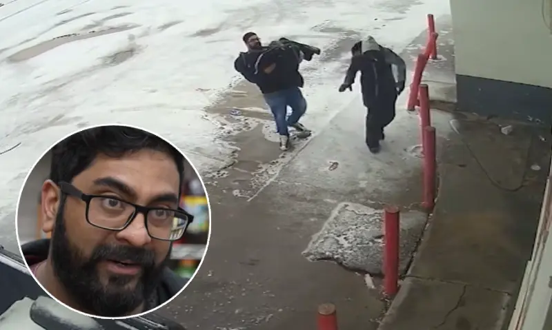 man carries frozen woman inside winter storm